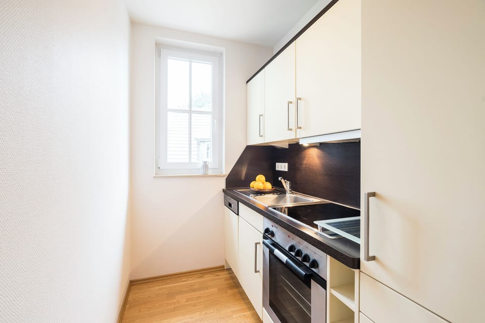Modern Kitchen with Window and Wooden Floor