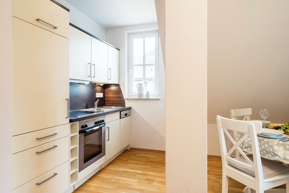 Modern Kitchen with Stove and Dining Area