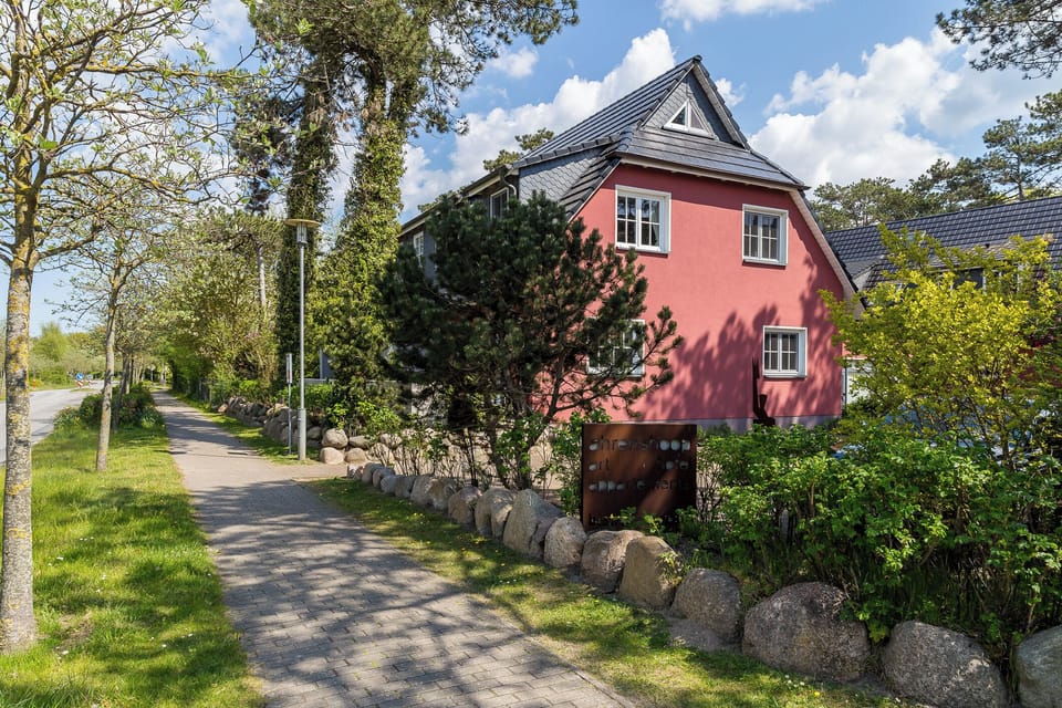 Exterior view of a red house in nature