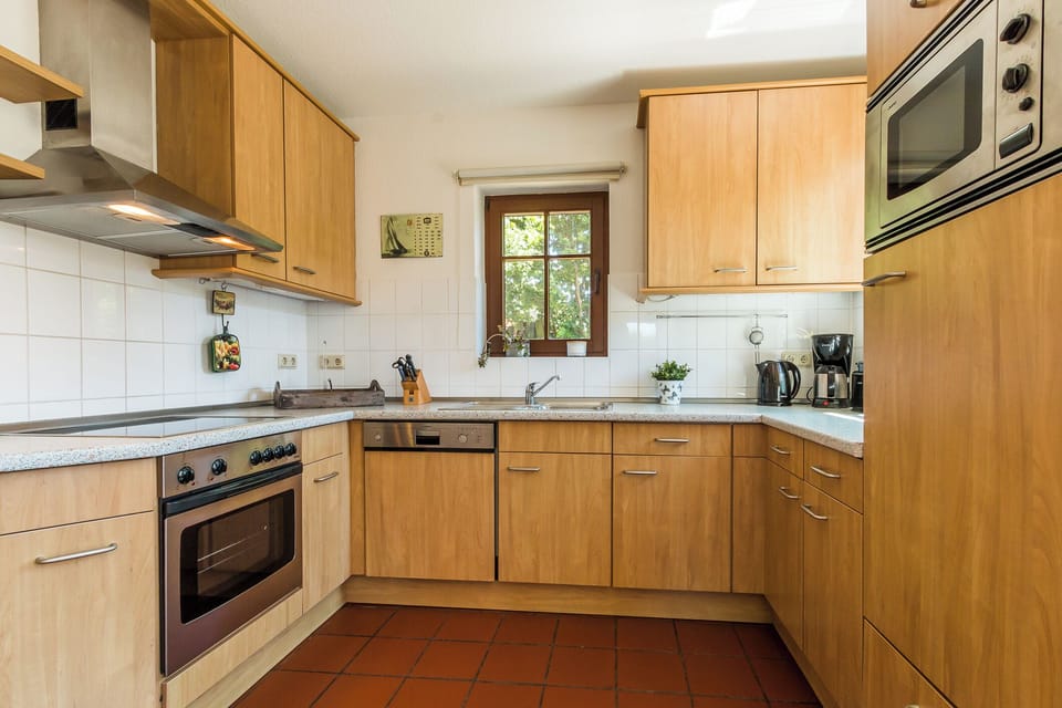Modern Kitchen with Wooden Cabinets and Window