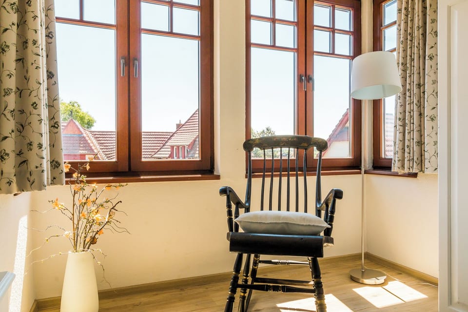 Bright living room with chair and windows