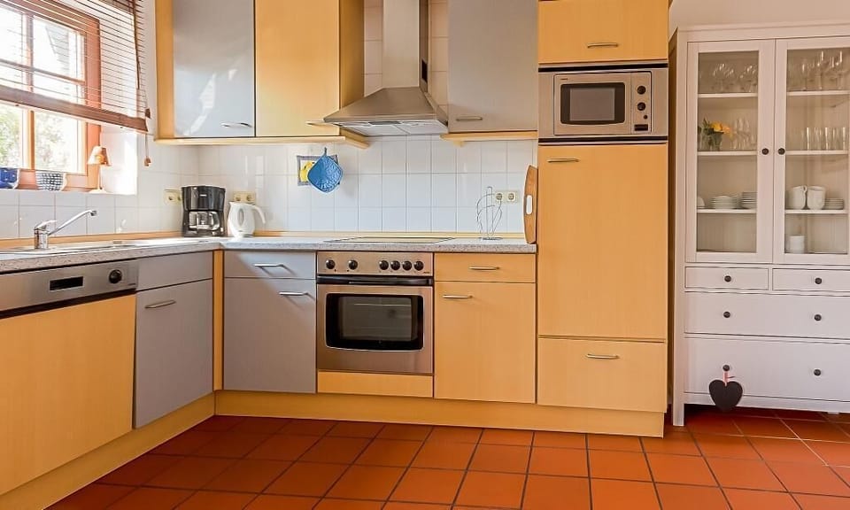 Modern kitchen with wooden shelves and appliances