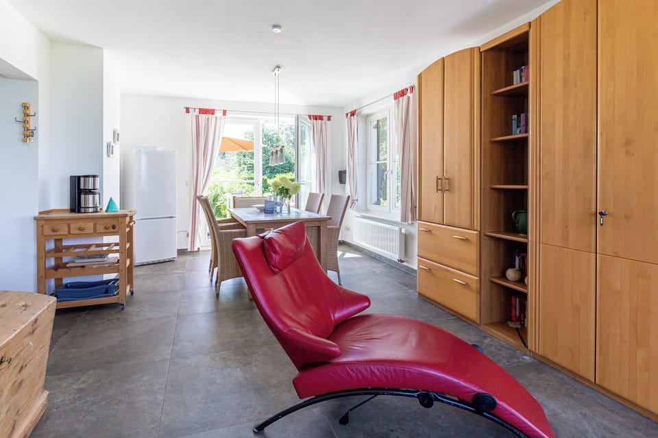 Kitchen with Red Chairs and Wooden Furniture