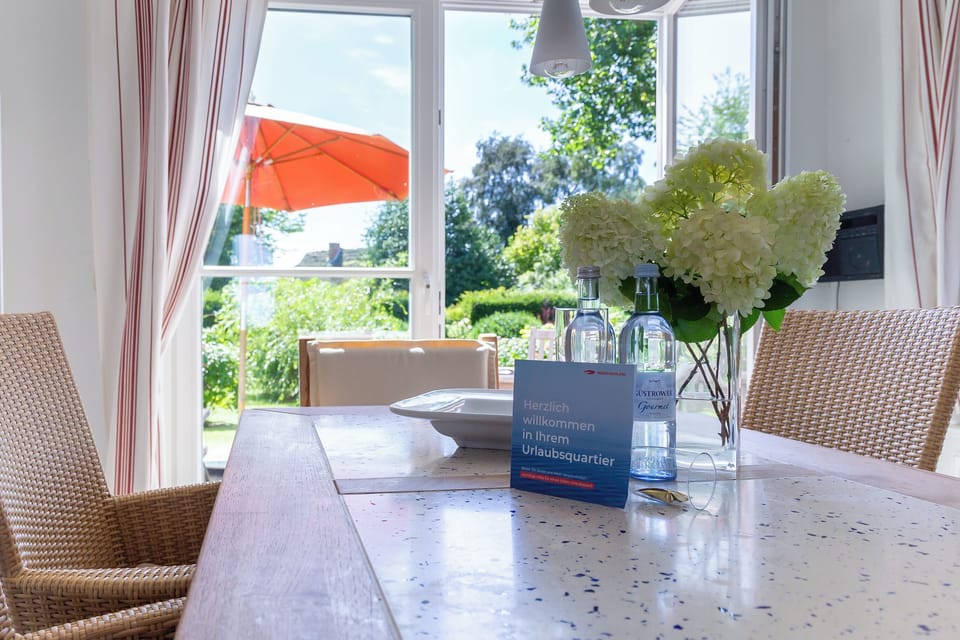 Kitchen with large table and garden view