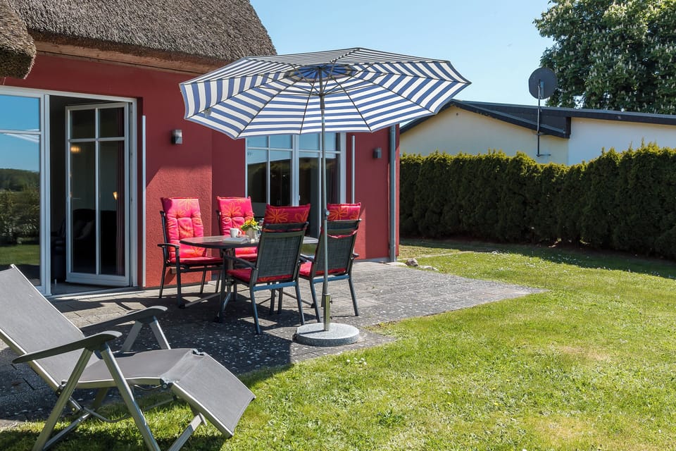 Terrace with table and sunshade