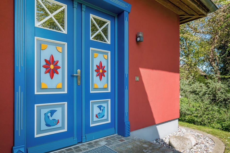 House entrance with colorful door motifs