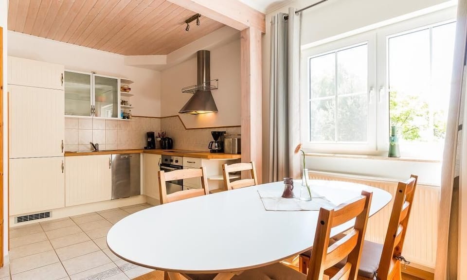 Modern kitchen with dining table