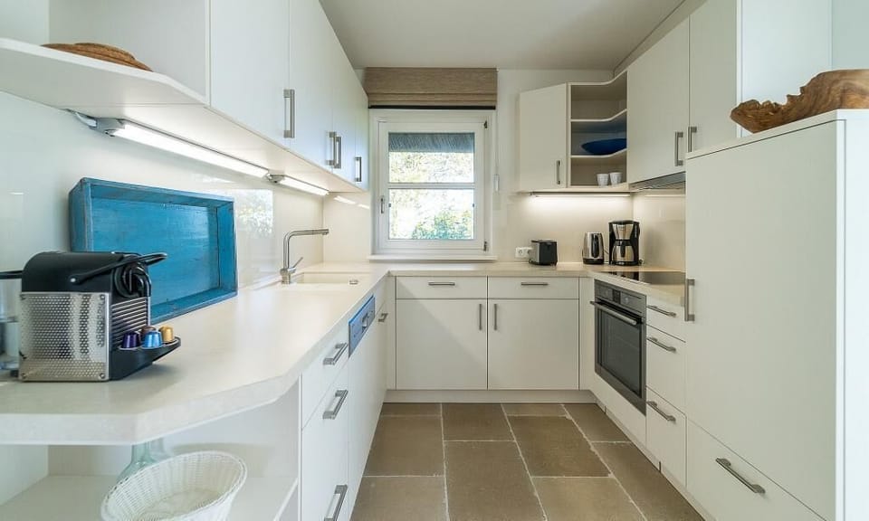 Modern Kitchen with White Cabinets and Appliances