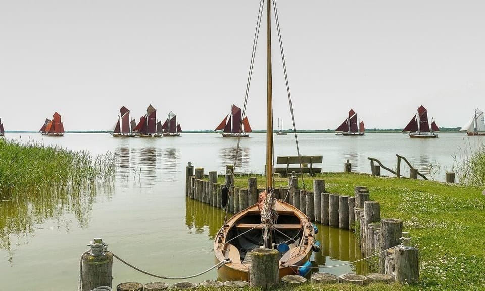 Beach with Boat and Sailing Boats