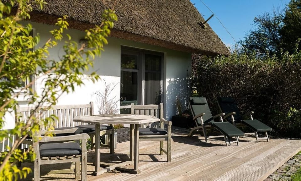Terrace with table and loungers