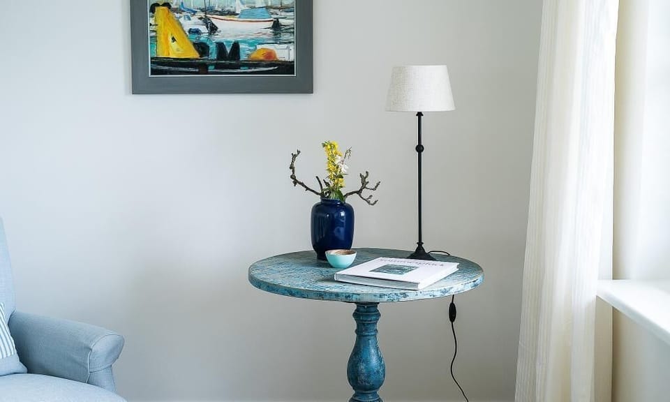 Living room with blue table and lamp