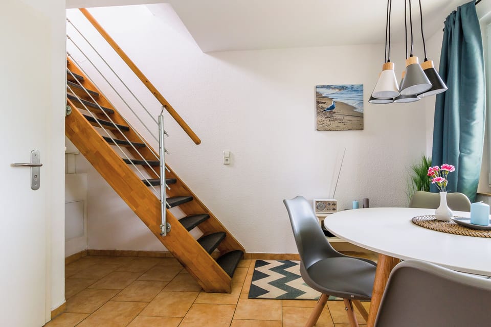 Modern Kitchen with Table and Stairs