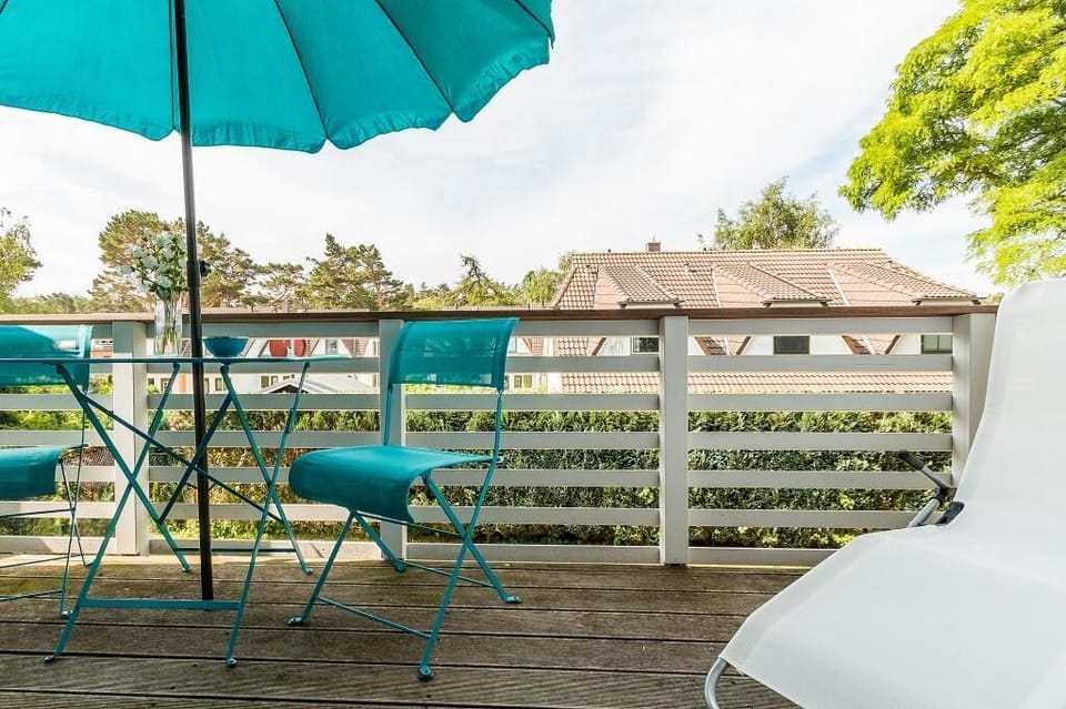 Modern Terrace with Chairs and Parasol