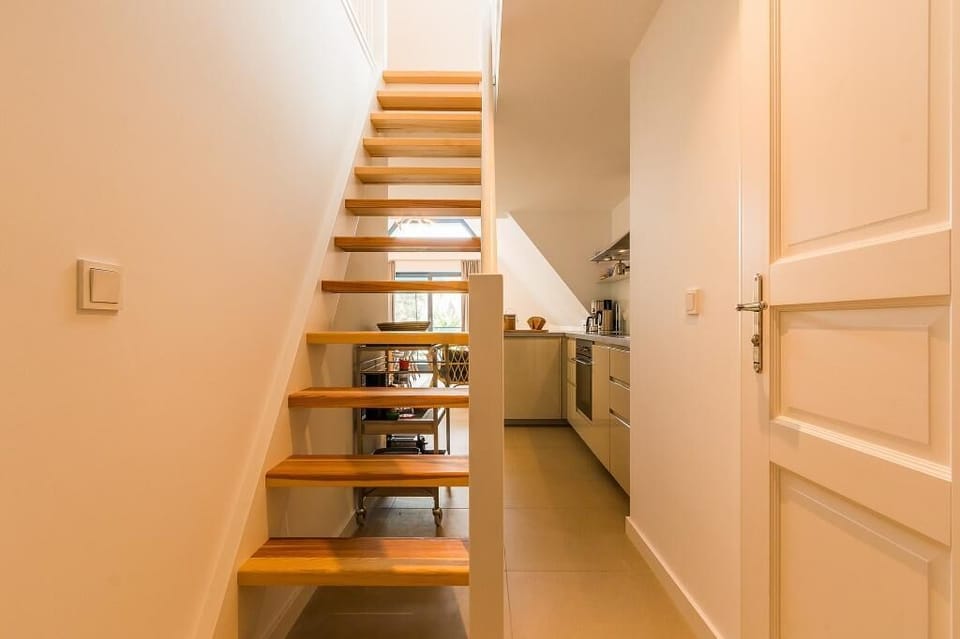 Staircase with a View of the Kitchen