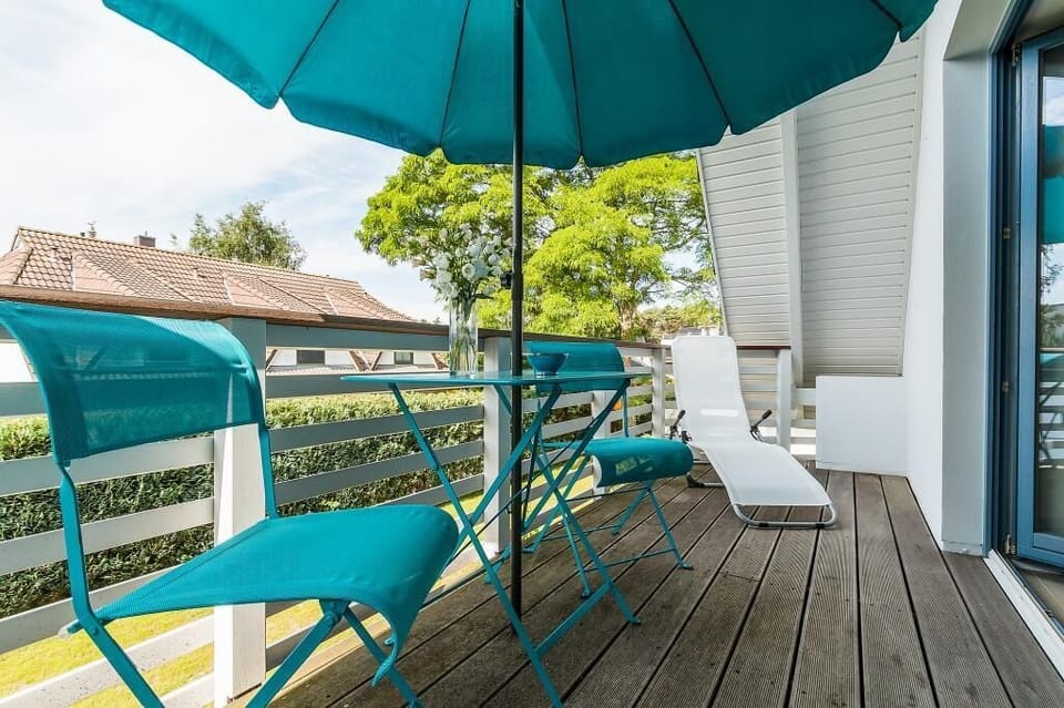 Terrace with Blue Chairs and Sun Umbrella