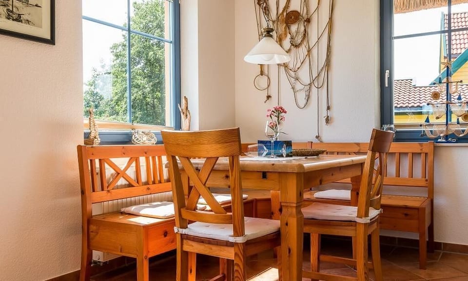 Bright kitchen with wooden chairs and table