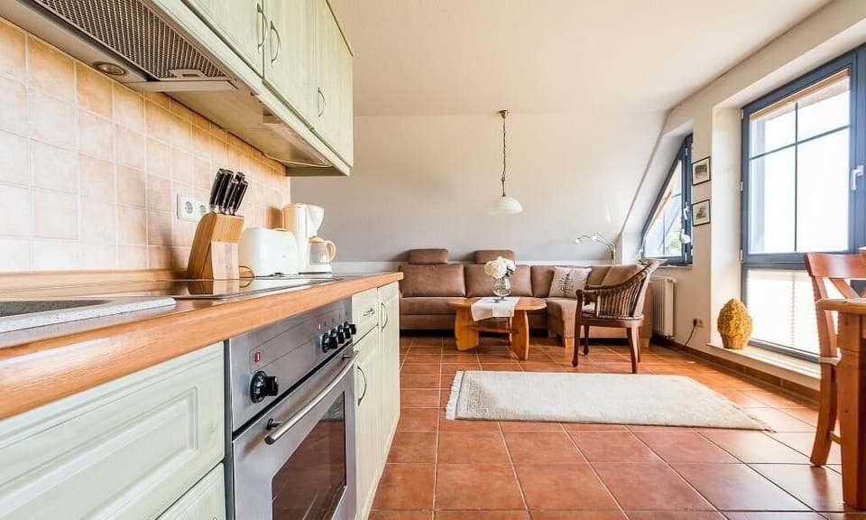 Living Room with Sofa and Modern Kitchen