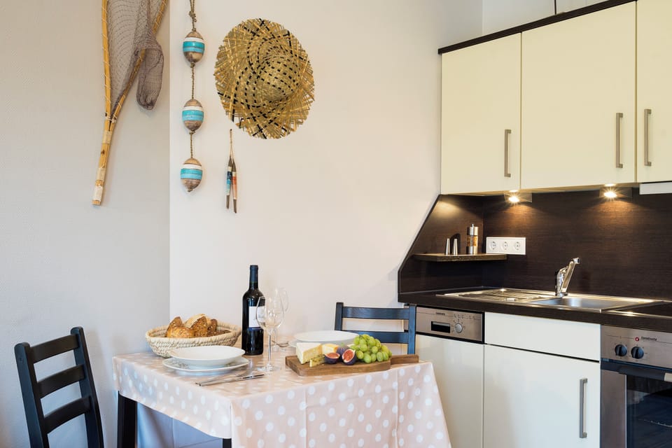 Modern Kitchen with Dining Table and Fruit