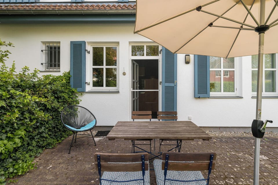 Terrace with table and sunshade