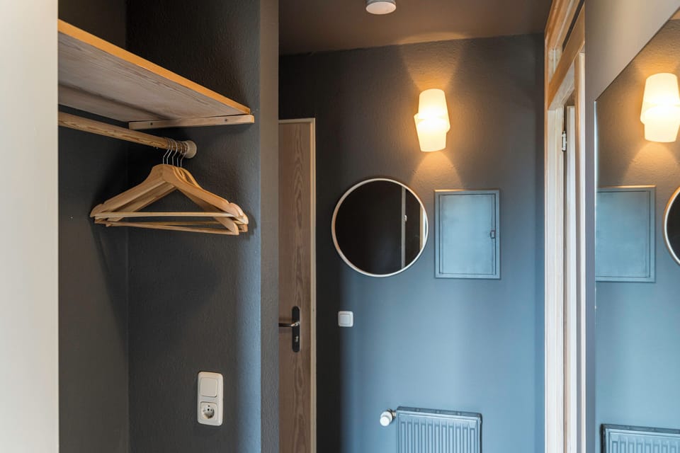 Modern Hallway Design with Mirror and Coat Hangers