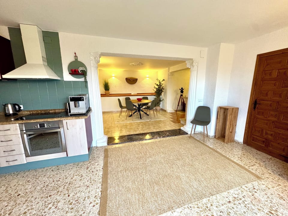 spacious living room with kitchen and dining area