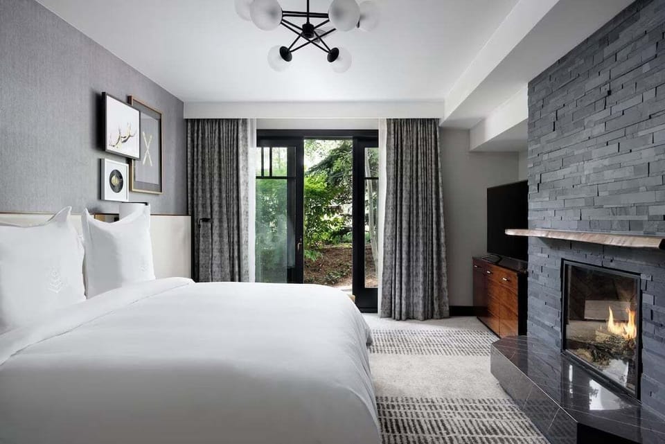 King Room offers gas fireplace, living area, separate soaking tub, mini-bar, desk, daily housekeeping, and more