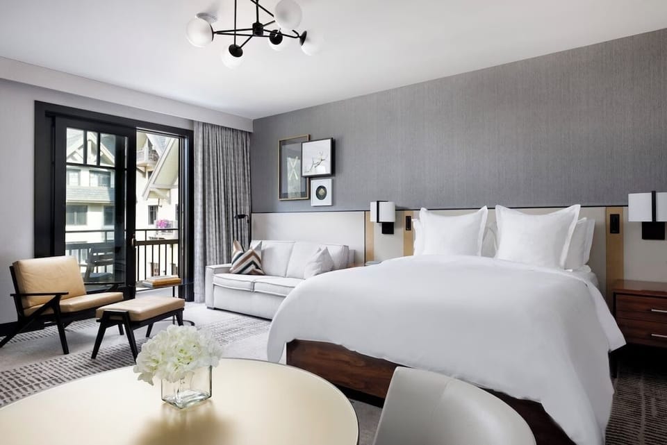 Premier King Room offers gas fireplace, living area, separate soaking tub, mini-bar, desk, daily housekeeping, and more