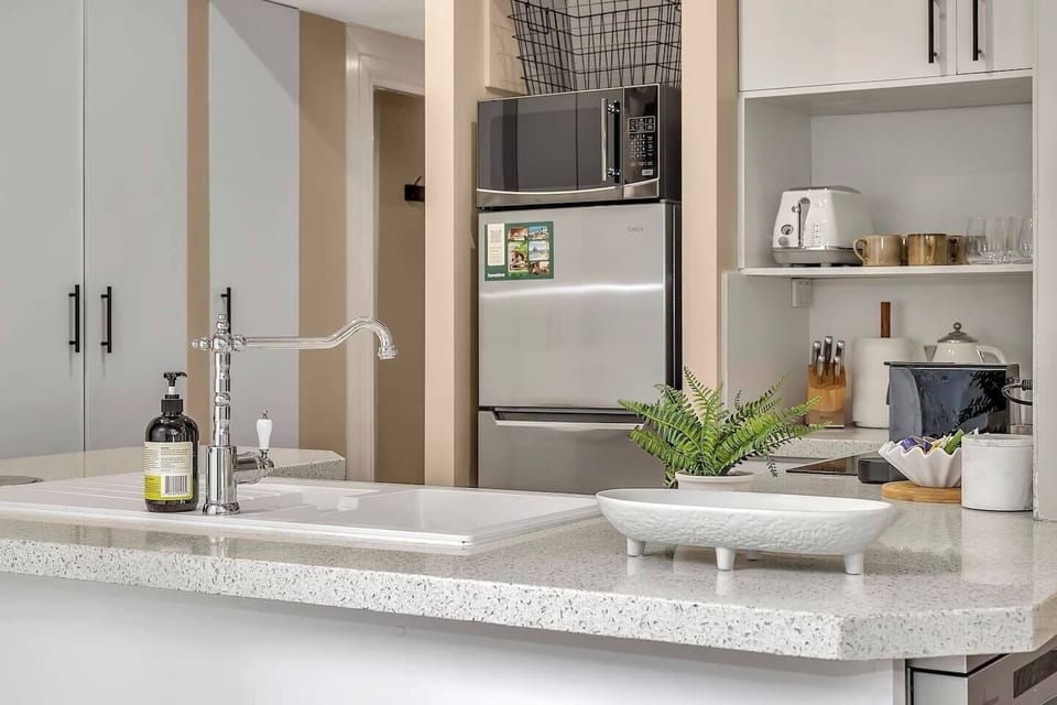 Prepare your morning brew with the Nespresso machine or cook a relaxed dinner in the compact yet efficient kitchen with essential appliances.