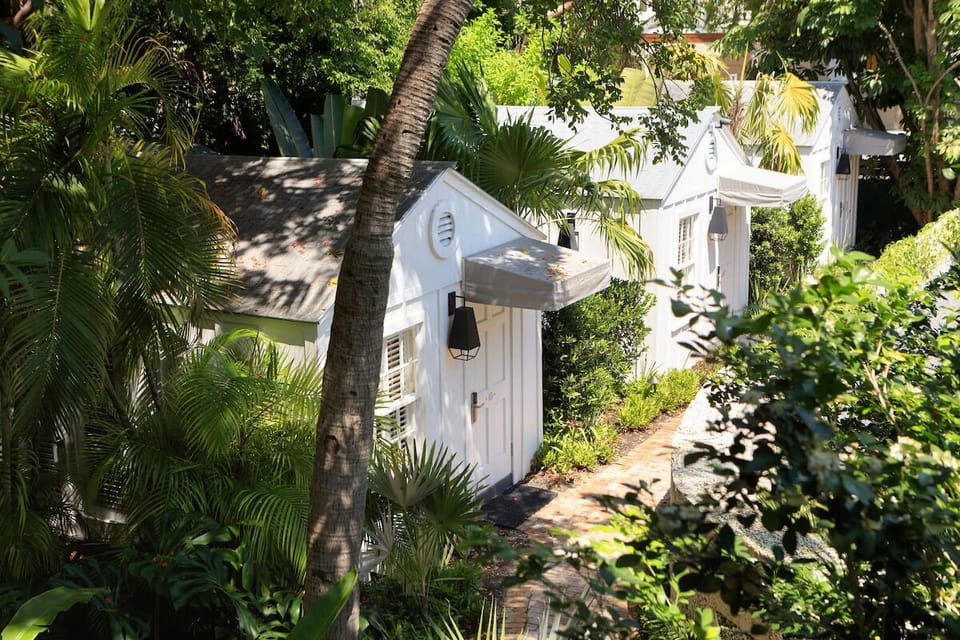 Stroll shaded garden paths to your private, cottage-style space.