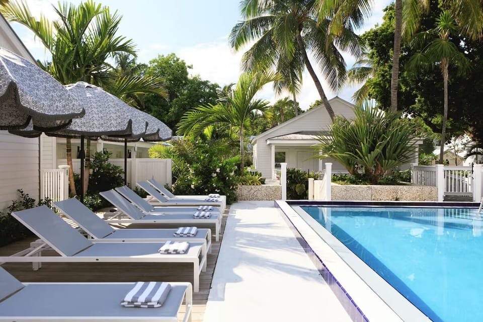 Dive into sunshine and lounge poolside in tropical calm.
