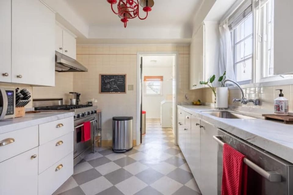 Kitchen with marble countertops, Viking range, and all small appliances.