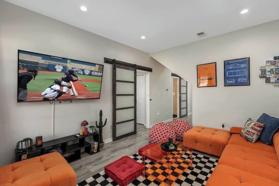 Kick back in our cozy living room, complete with a large TV and plush seating perfect for your movie nights or game days.