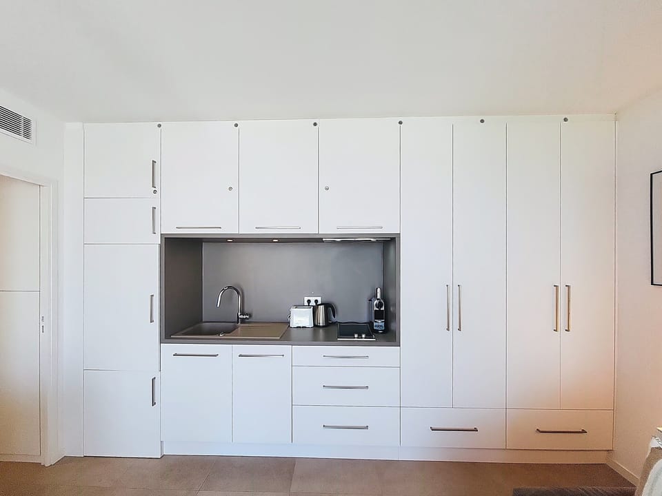 opened fully equiped kitchen