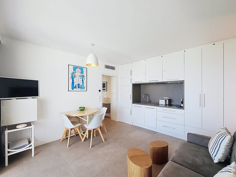 living room, kitchen, flat screen tv and eating space