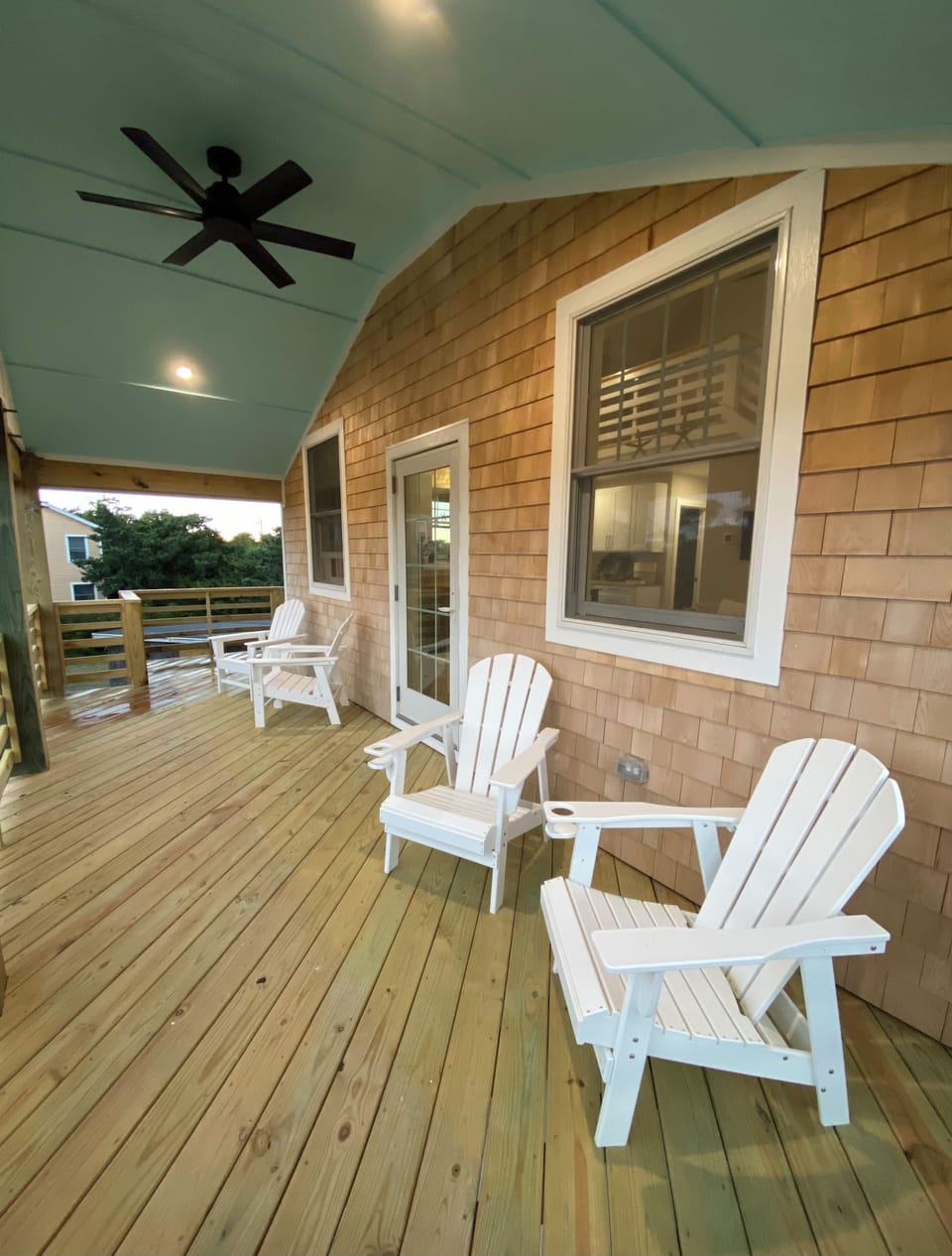Large deck for relaxing with 4 Adirondack chairs