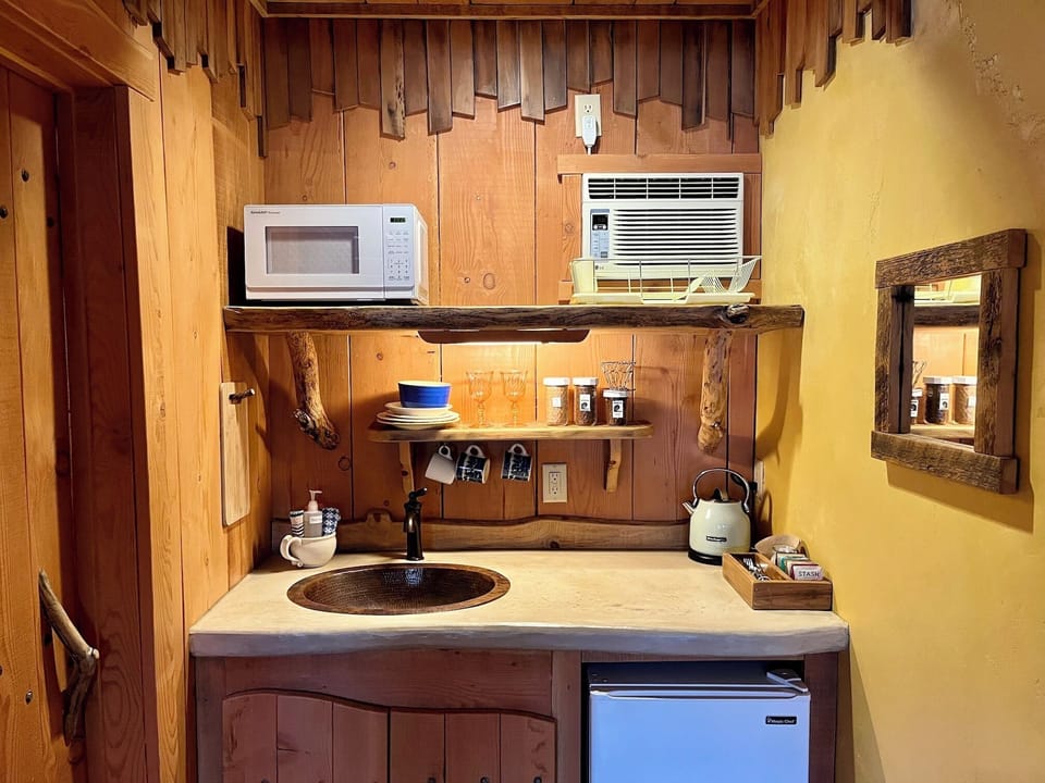 Microwave, mini fridge,hot water kettle, filter for coffee, some dishes/utensils
