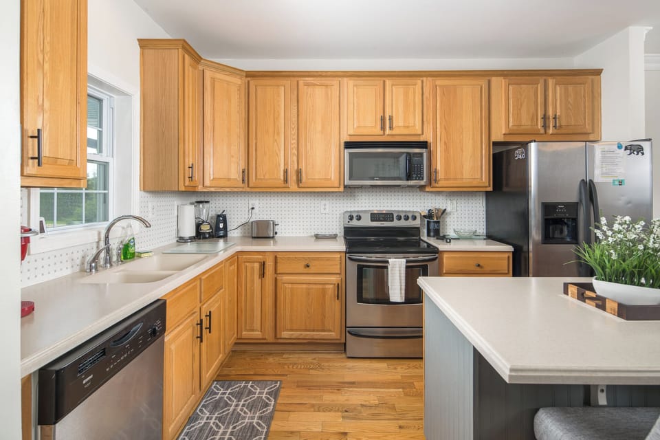 Bright kitchen featuring full appliances and inviting space.