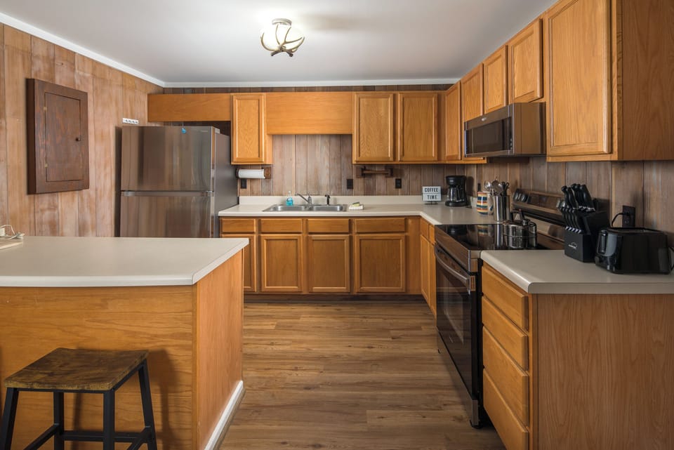 Fully equipped kitchen with modern appliances and ample counter space.