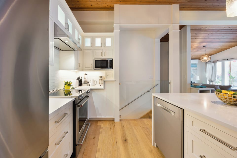 Kitchen with all the appliances and cooking essentials.