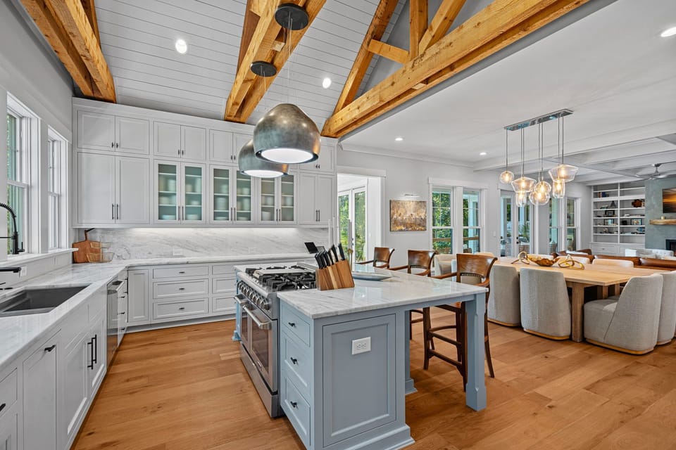 Fully stocked kitchen with island seating for 3.
