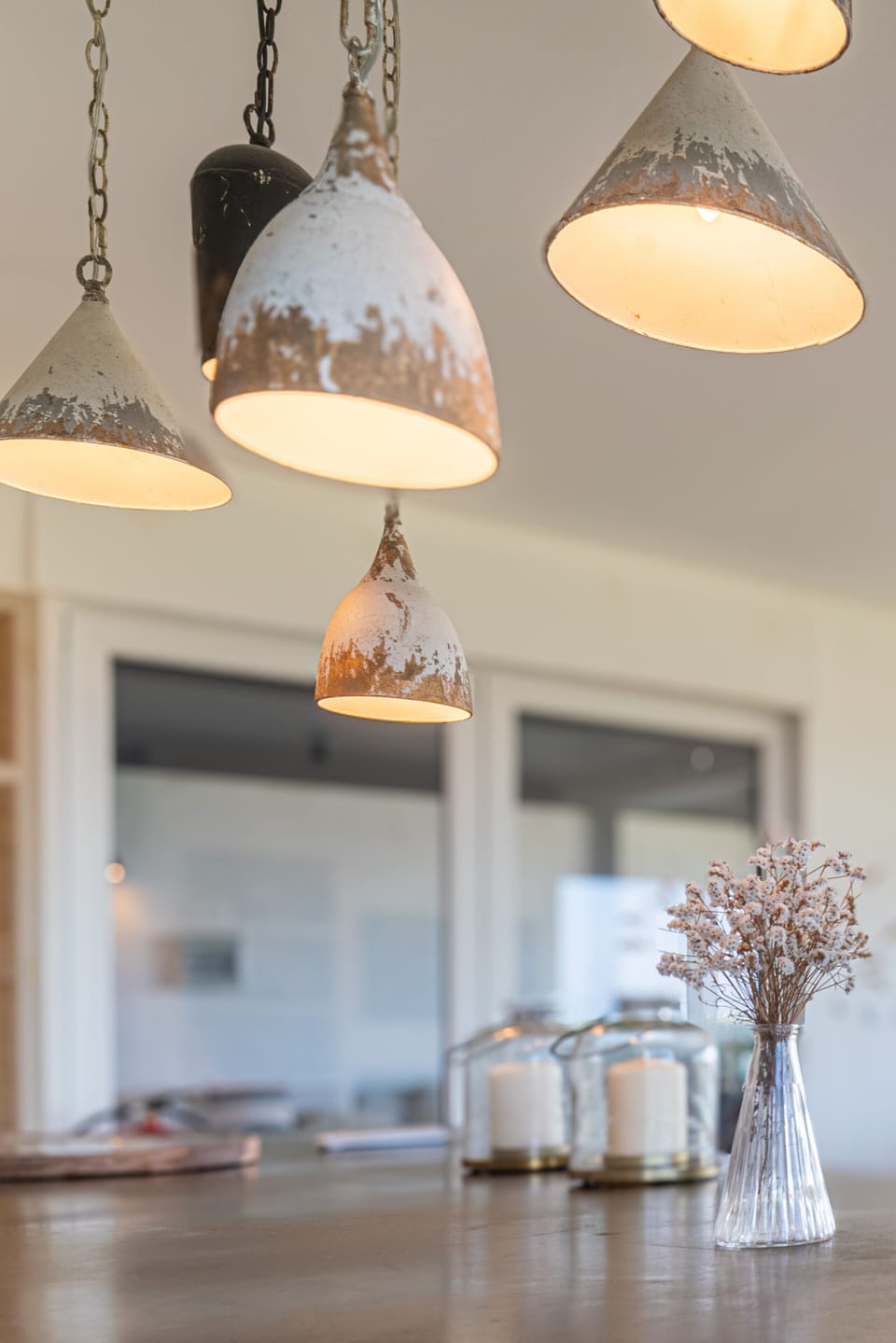 Pendant lights with distressed finishes over dining table — Villa Ambar, holiday villa in Sintra