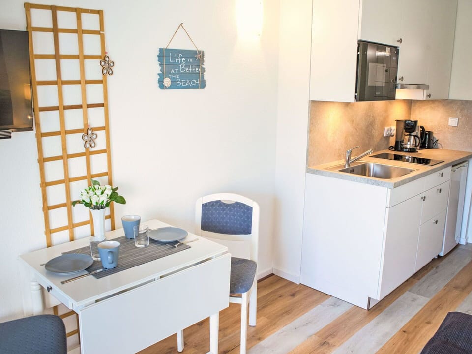 Furniture, Interior Design, Flooring, Wood, Floor, Kitchen, Room, Cabinetry, Countertop, Lighting