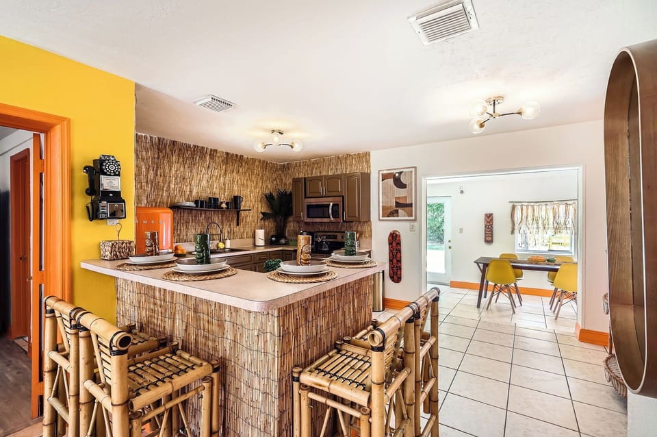 Large tiki-themed kitchen with counter stools to enjoy a tropical breakfast