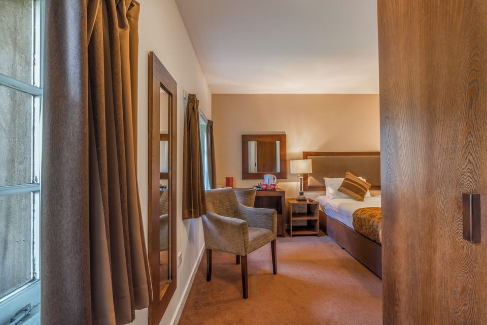 Glide in from the entry to a calm, welcoming bedroom.