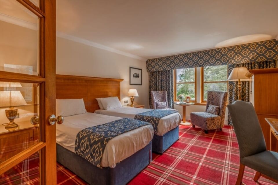 Unwind in twin beds with cozy tartan comfort.