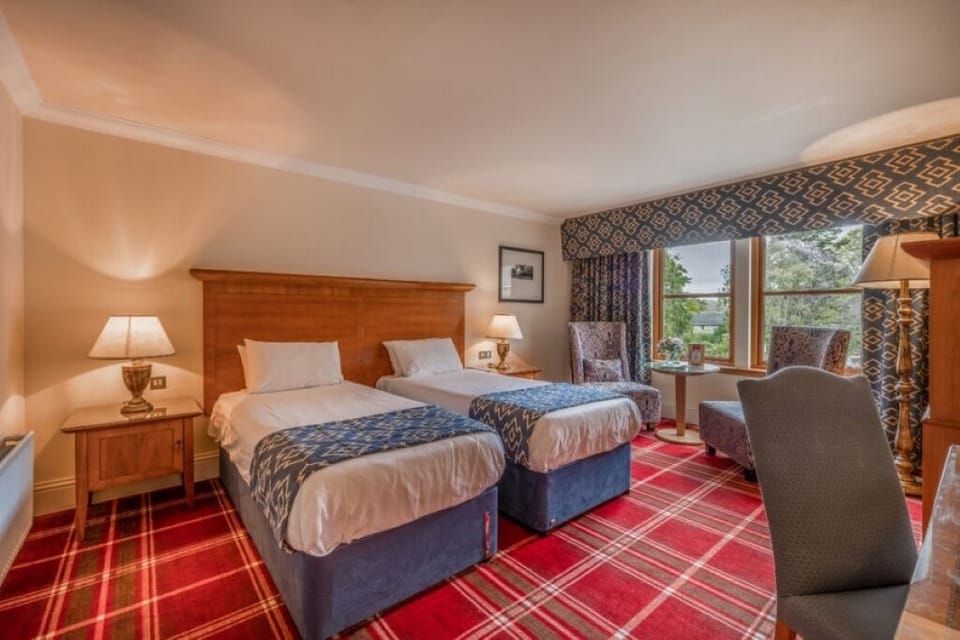 Sink into crisp linens and wake to leafy views.