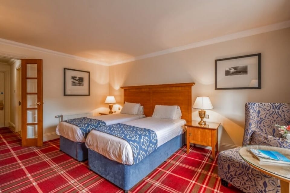 Wake up refreshed in sunny twin beds beside the picture window.