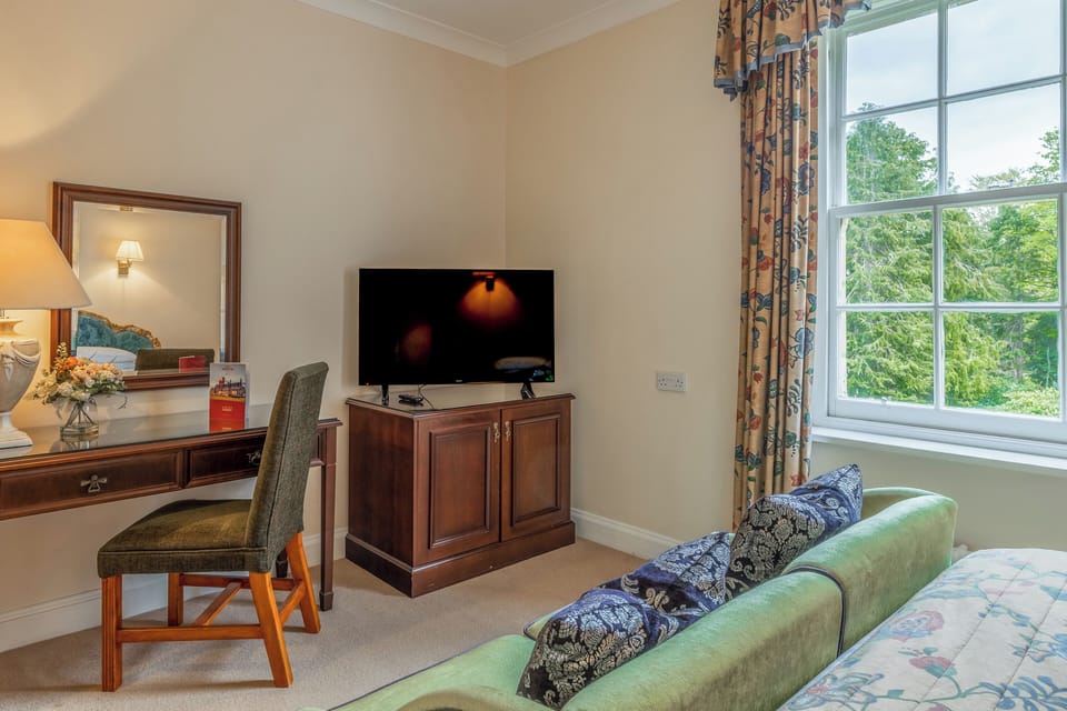 Catch up on emails at the desk, then relax with TV.