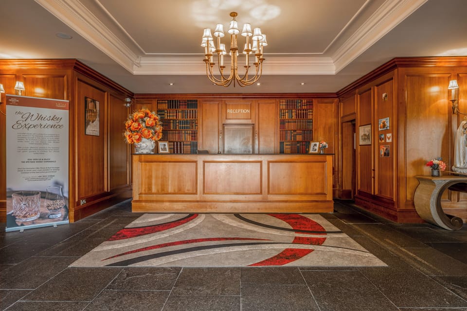 Step into warm wood elegance at the welcoming reception.