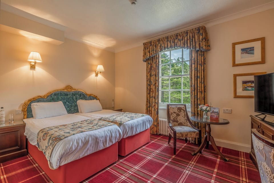 Stretch out in a spacious room with seating and garden outlook.